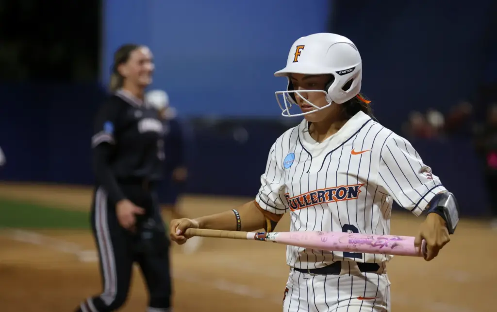 Cal State Fullertonâs Sarah Perez walks off the field after...