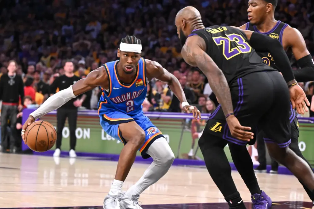 Oklahoma City Thunder star Shai Gilgeous-Alexander, left, looks for a...