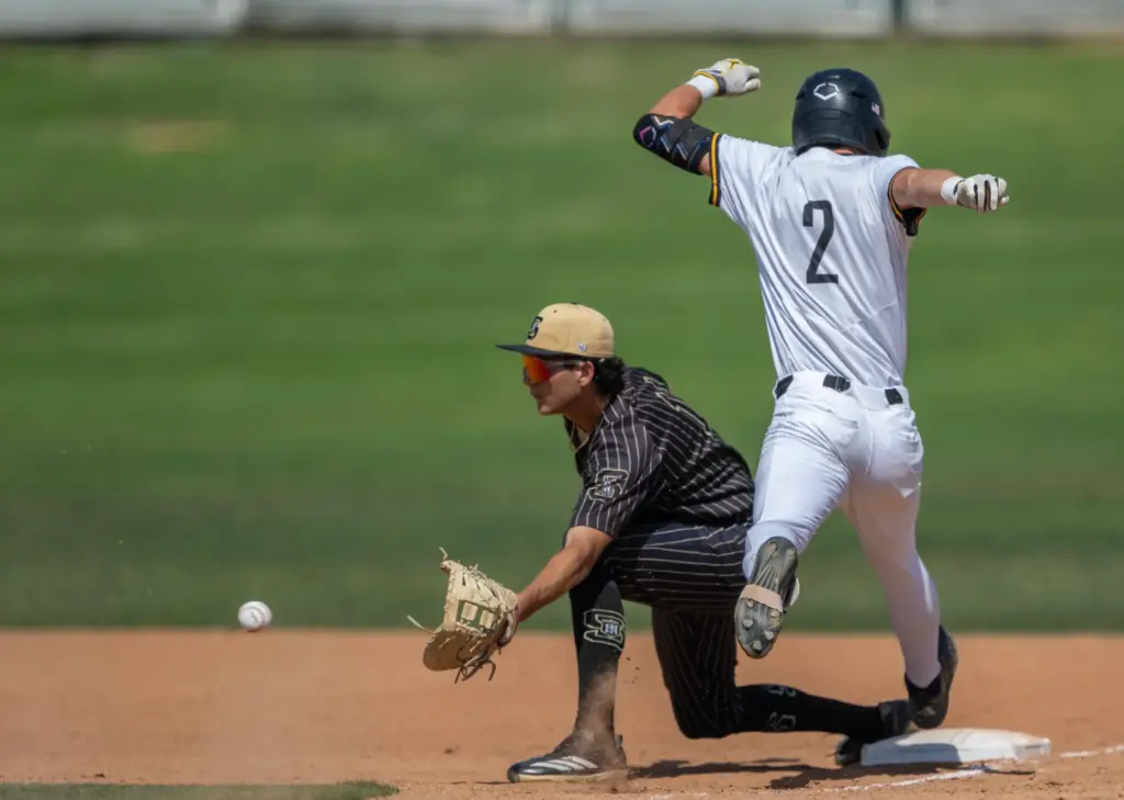 Foothill outfielder Brayden Bianchi gets safely to first base in...