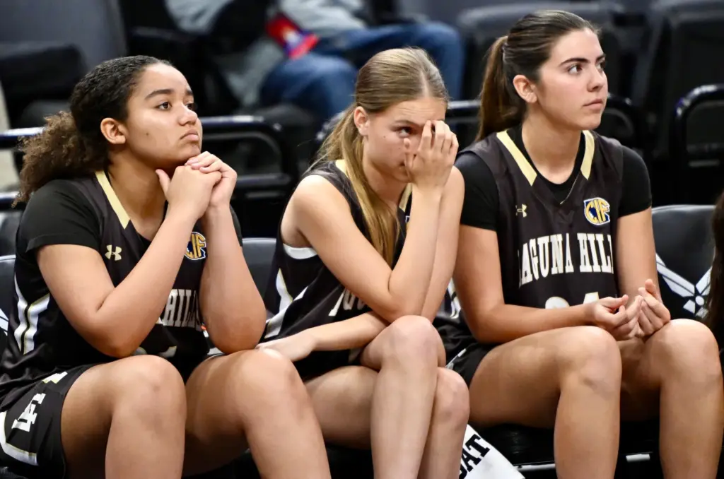 Laguna Hills bench look on against Woodland Christian in the...