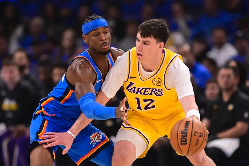 Lakers forward Jake LaRavia handles the ball as Oklahoma City...