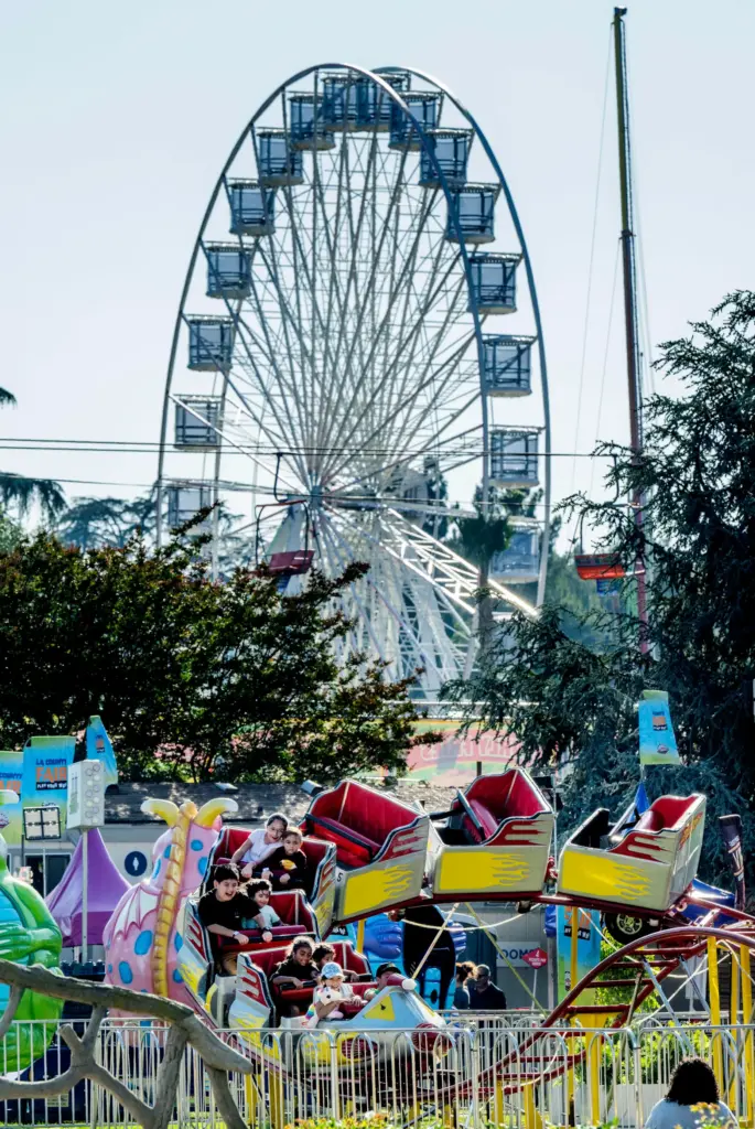 Children enjoy a ride as fair goers enjoy opening day...