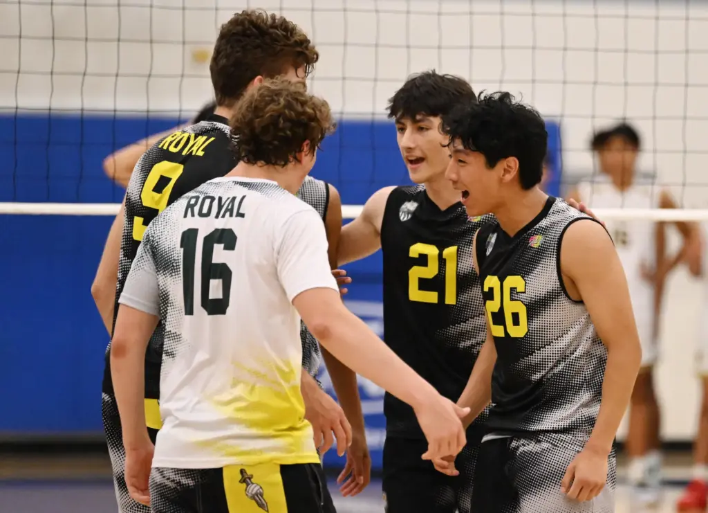 Micah Park #26 of the Royal Highlanders reacts with teammates...