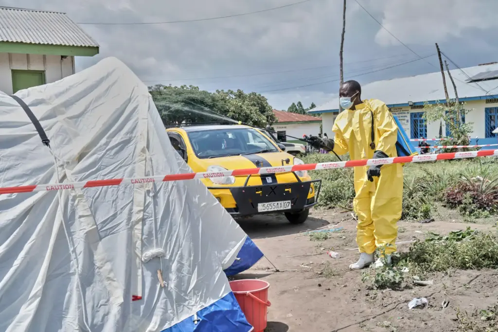 A man sprays a tent at an Ebola treatment center in Bunia, Congo.