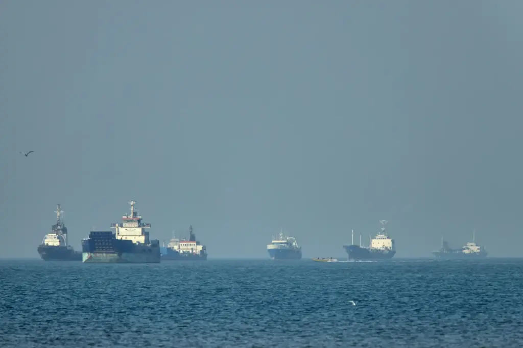Cargo ships sit at anchor in the Strait of Hormuz.