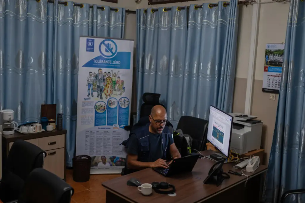 Olivier Nkakudulu, country director of the World Food Programme in Ituri province, works in his office.