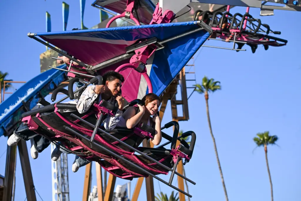 Fairgoers enjoy the rides during the final weekend of the...