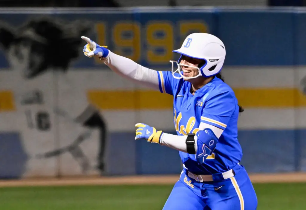 Bri Alejandre #22 of the UCLA Bruins reacts after hitting...