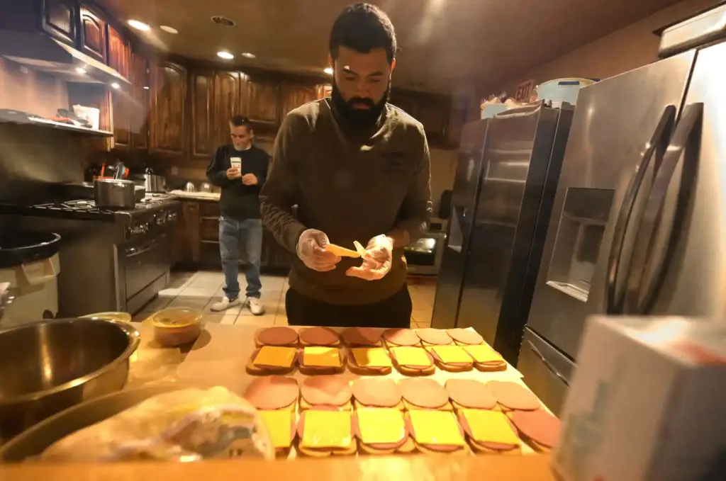 âRancherâ Rafael Rivera, 33, of Bellflower prepares sandwiches for ranchers...