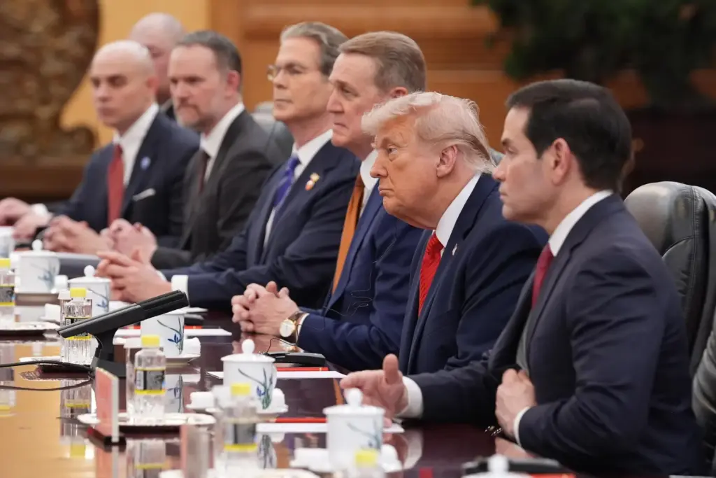President Donald Trump listens as he meets with China's President Xi Jinping.