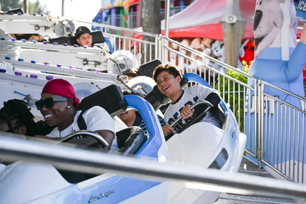 Fairgoers enjoy the rides during the final weekend of the...
