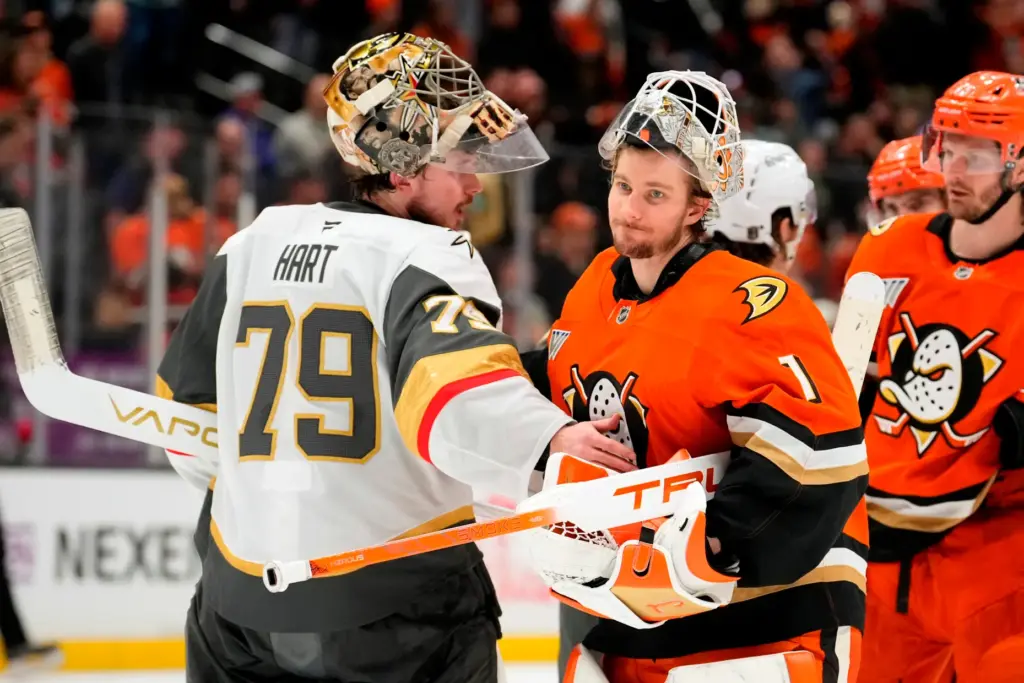 Vegas Golden Knights goaltender Carter Hart, left, is congratulated by...