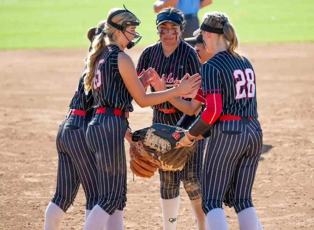 Mission Viejo infielders high five each other at the mound...