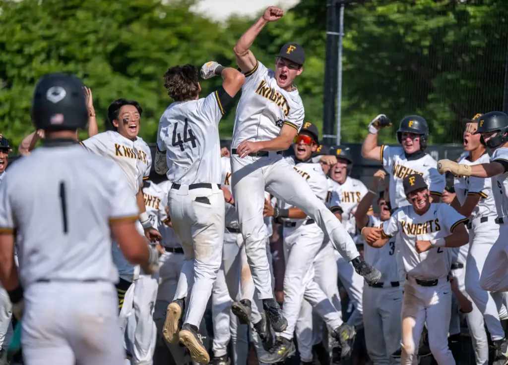 Foothill players celebrate a home run by infielder Jaxon Foshay...