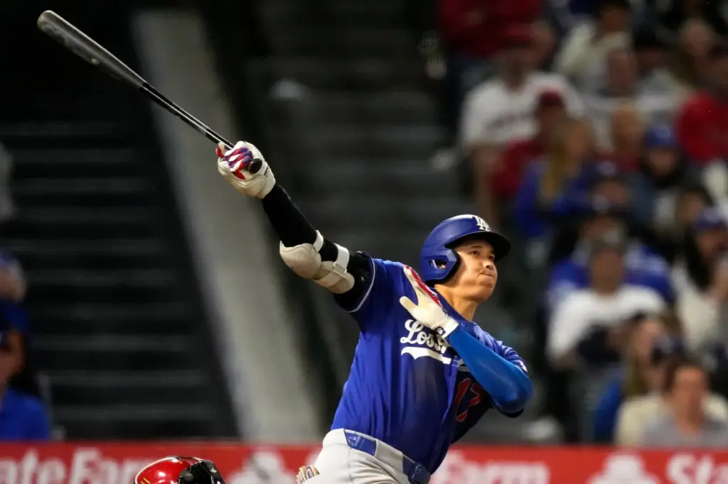 Dodgers’ Shohei Ohtani hits a three-run inside-the-park home run during...