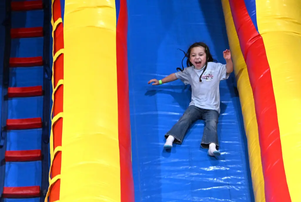Melrose Harton, 2, of Corona enjoys the slide at the...