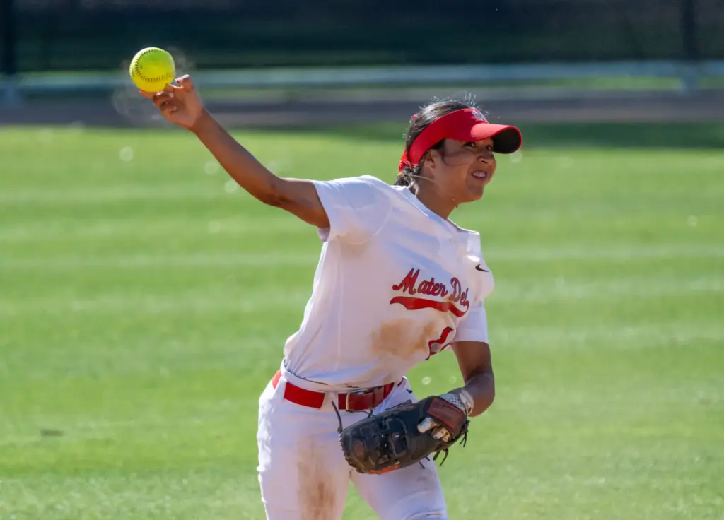 Mater Dei shortstop Alexandra Carrillo throws to first base after...