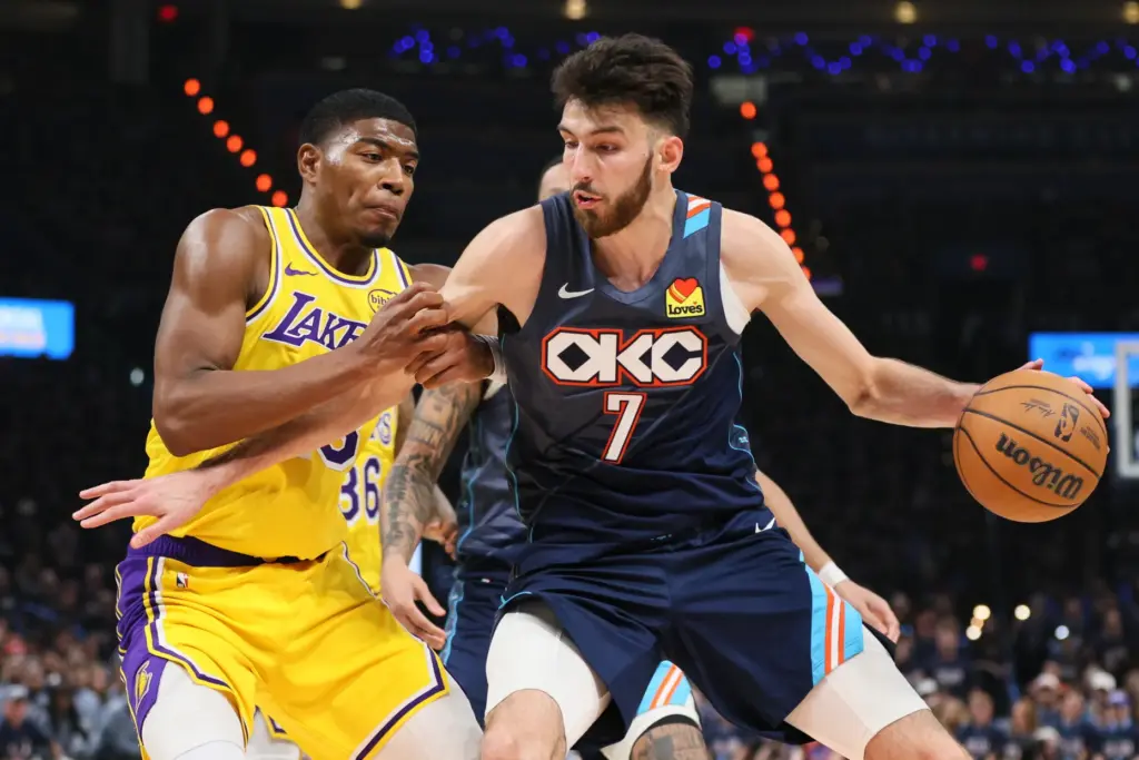 Oklahoma City Thunder center Chet Holmgren (7) works to the...