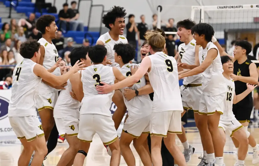 Sunny Hills Lancers celebrate after defeating the Royal Highlanders to...