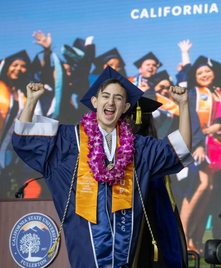 An enthusiastic Andrew Bonilla graduates from Cal State Fullertonâs College...
