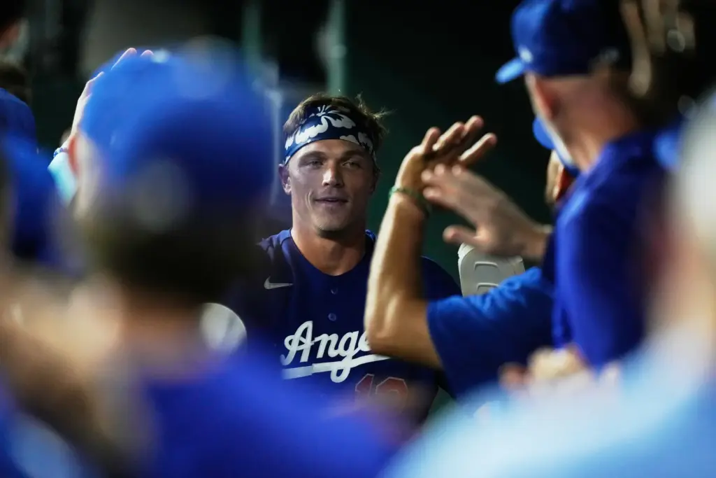 The Dodgers’ Alex Call celebrates in the dugout after scoring...