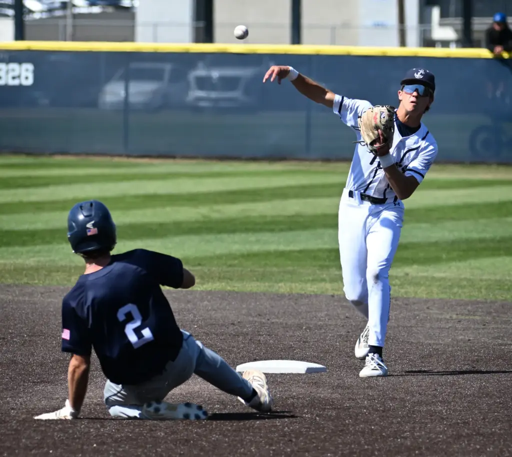 Oren Damush (22) of Newport Harbor makes the out at...
