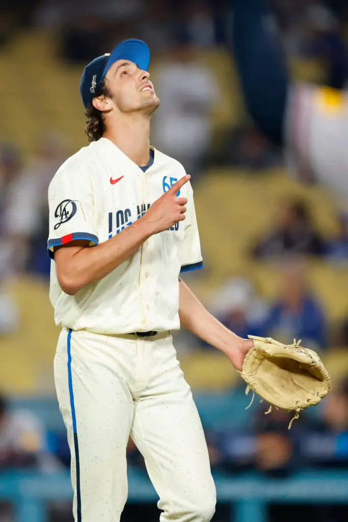 Dodgers relief pitcher Paul Gervase (65) reacts after recording the...