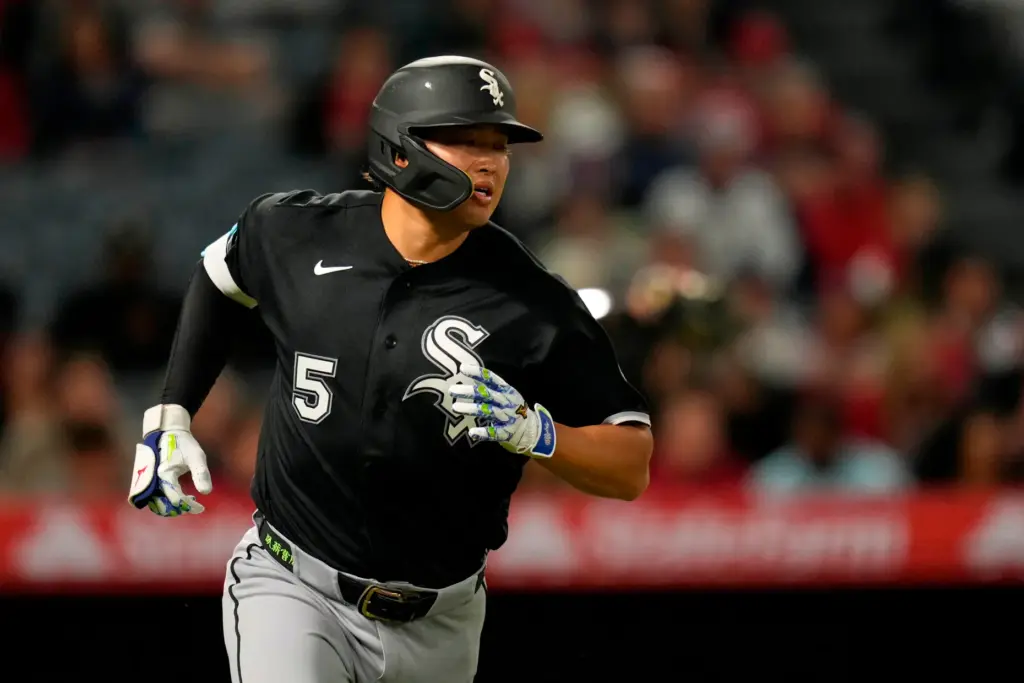 Chicago White Sox slugger Munetaka Murakami runs to first base...
