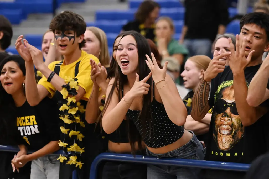 Sunny Hills fans celebrate after the Sunny Hills Lancers defeated...