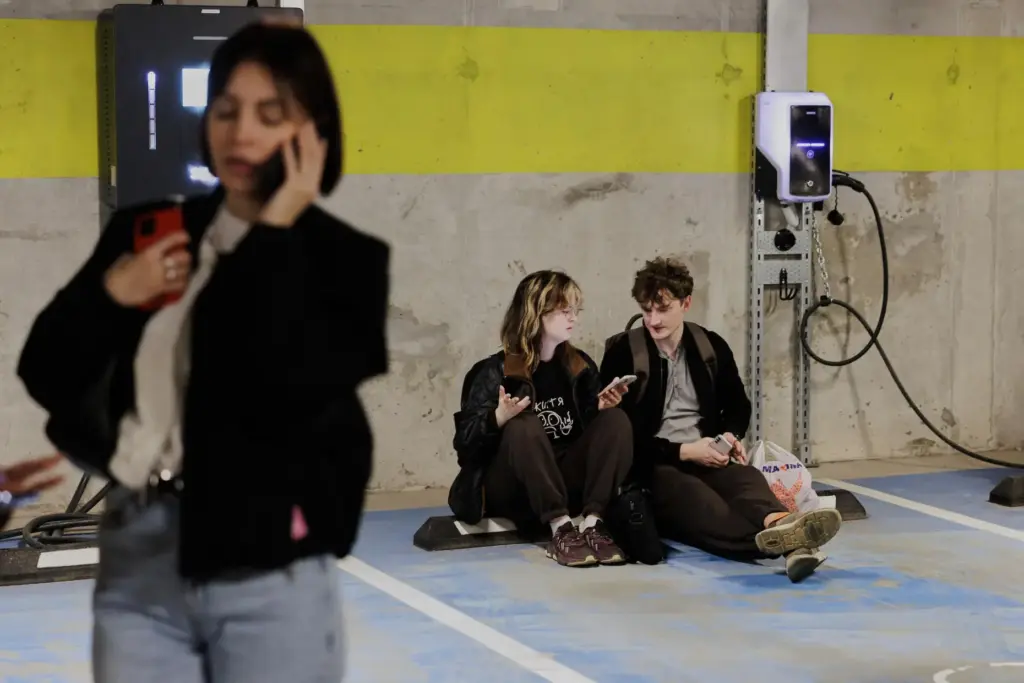 People take shelter in an underground car park during an...