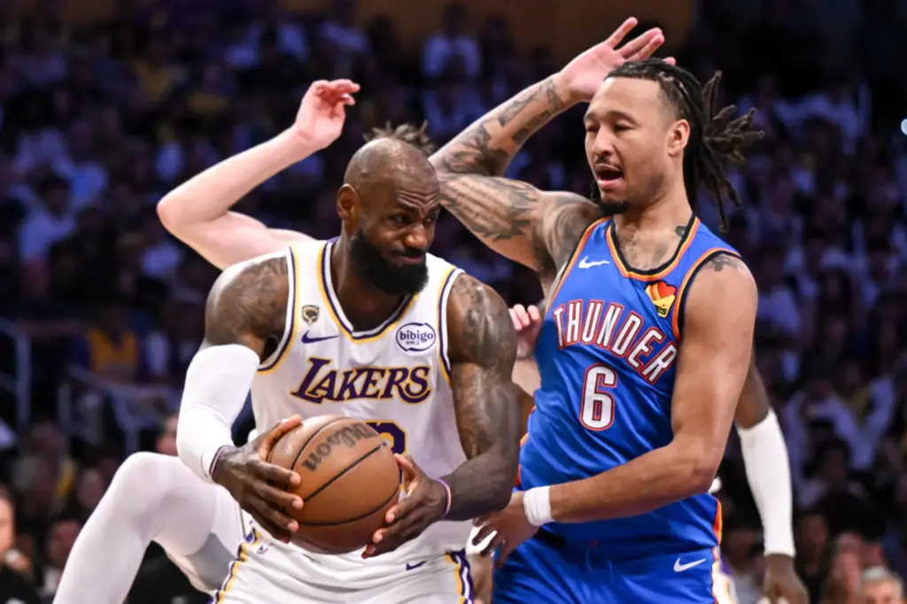 Lakers star LeBron James grabs a rebound as the Oklahoma...