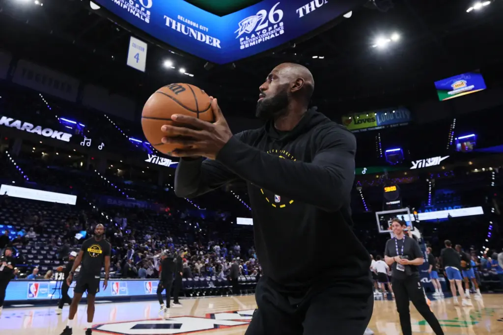 Lakers star LeBron James warms up before Game 2 of...