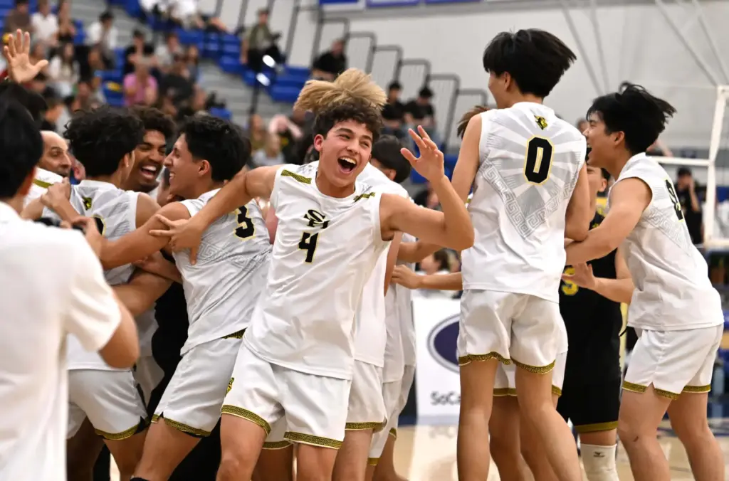 Sunny Hills Lancers celebrate after defeating the Royal Highlanders to...
