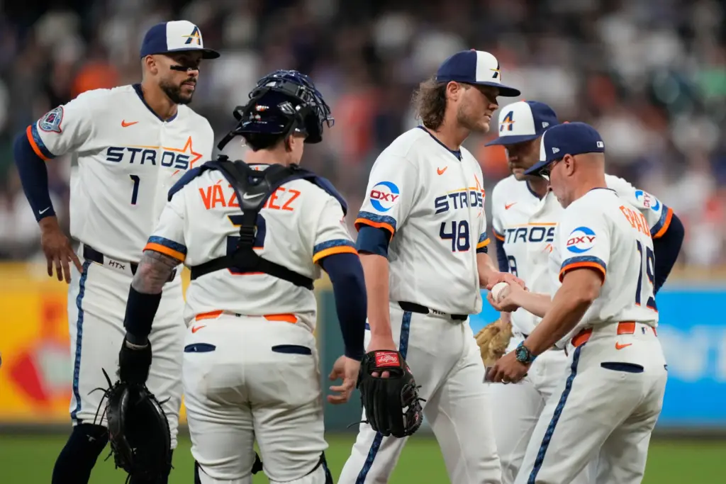 Houston Astros starting pitcher Steven Okert (48) leaves the mound...