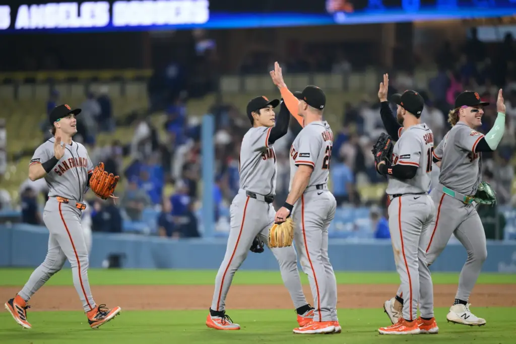San Francisco Giants players celebrate after their 9-3 victory over...