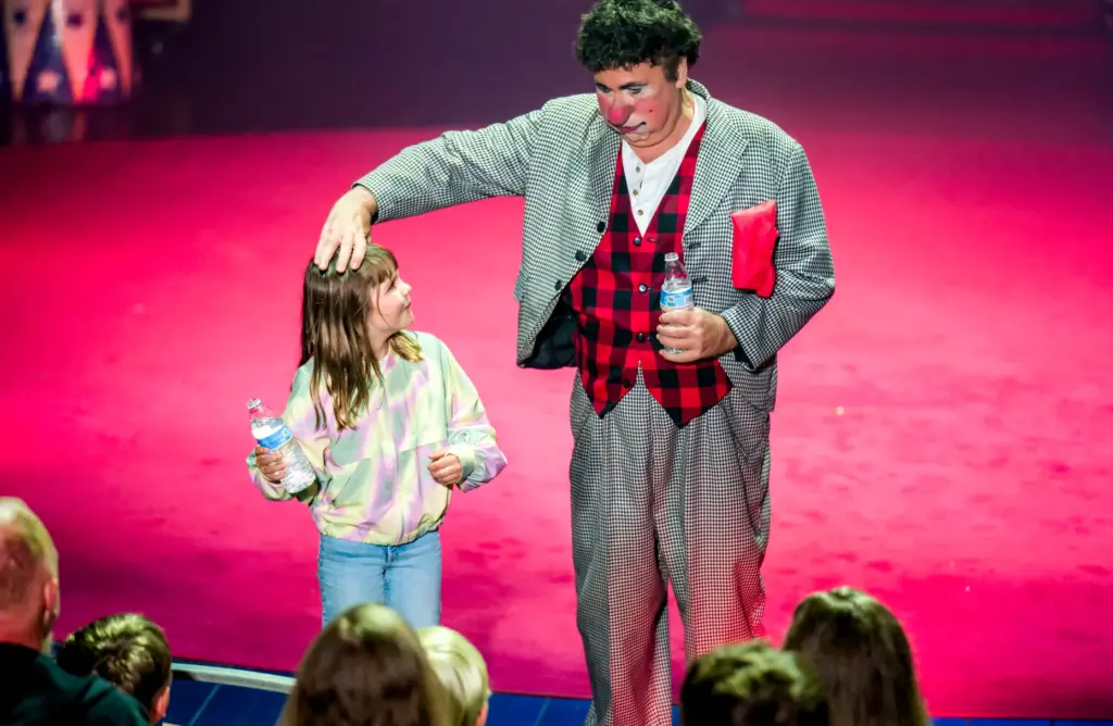 Elle Keith, 8, left, of Laguna Niguel reacts as Circus...