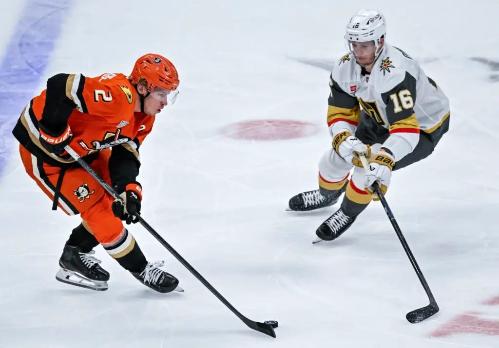 The Ducksâ Jackson LaCombe (2) controls the puck during the...