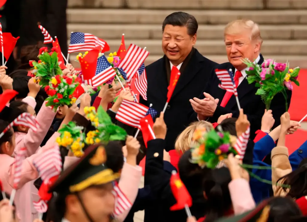 FILE – President Donald Trump and Chinese President Xi Jinping...