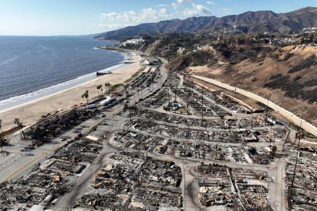 FILE – An aerial view shows the devastation left by...