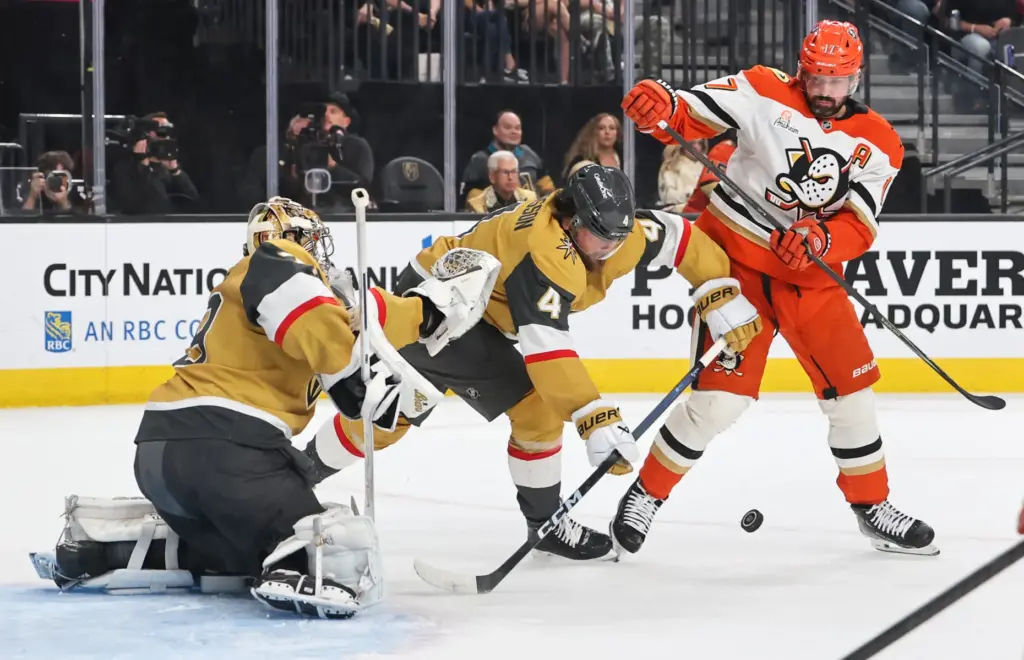 Vegas Golden Knights goaltender Carter Hart, left, and teammate Rasmus...