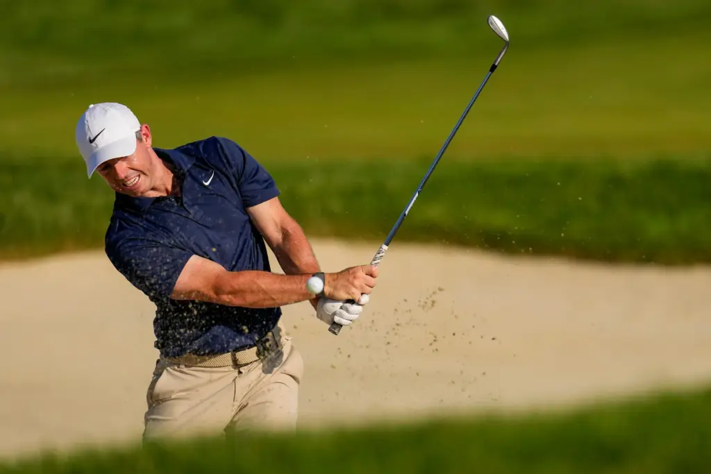 Rory McIlroy, of Northern Ireland, hits from the bunker on...