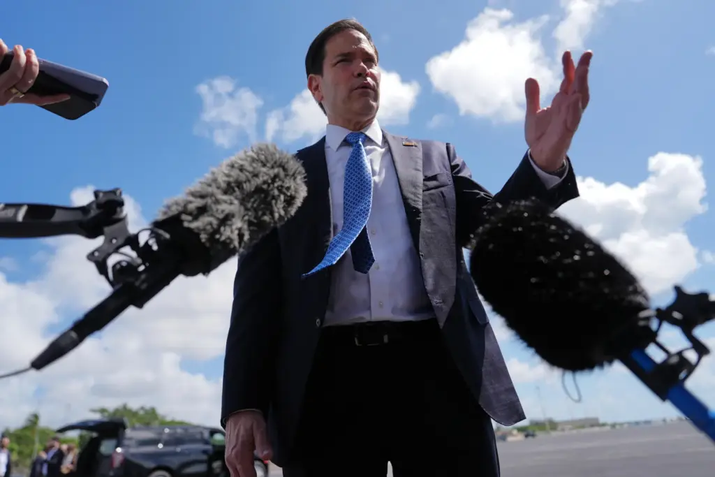 Secretary of State Marco Rubio speaks to the press before boarding his plane.