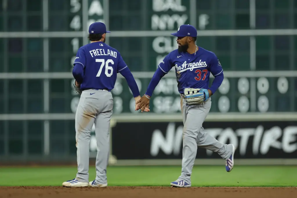 Dodgers infielder Alex Freeland, left, and outfielder Teoscar Hernandez celebrate...