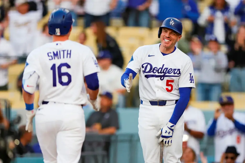 The Dodgers’ Freddie Freeman, right, greets designated hitter Will Smith...