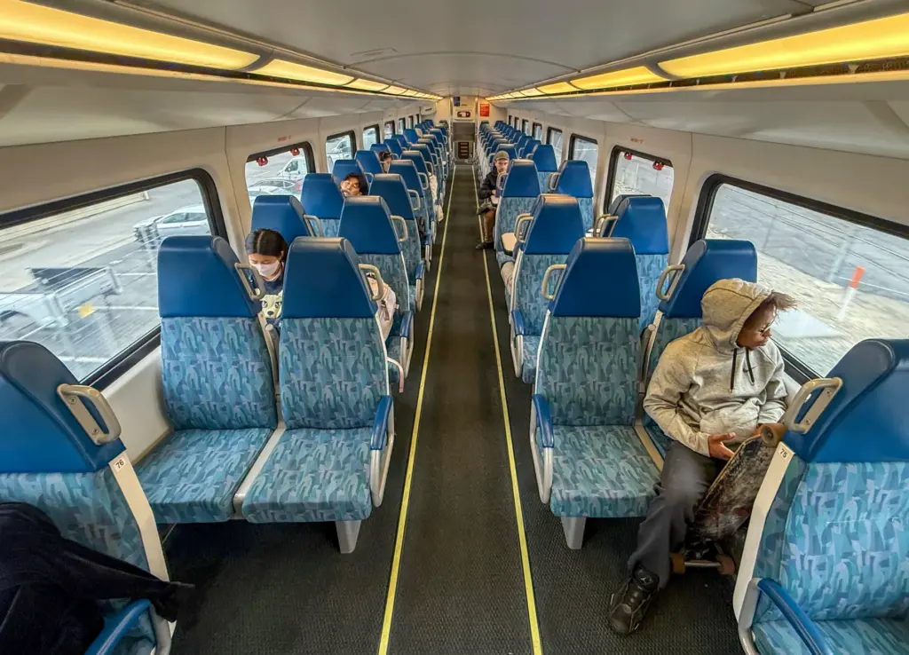 Riders aboard a southbound Metrolink train in Orange, CA, on...