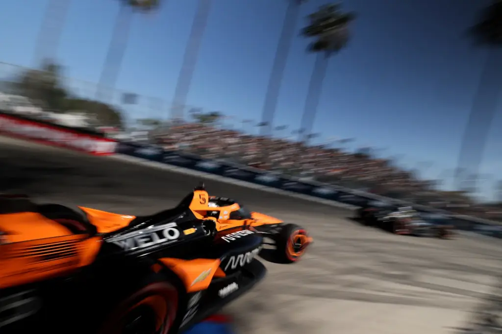 Indycar driver Pato OâWard races, left, races out of turn...