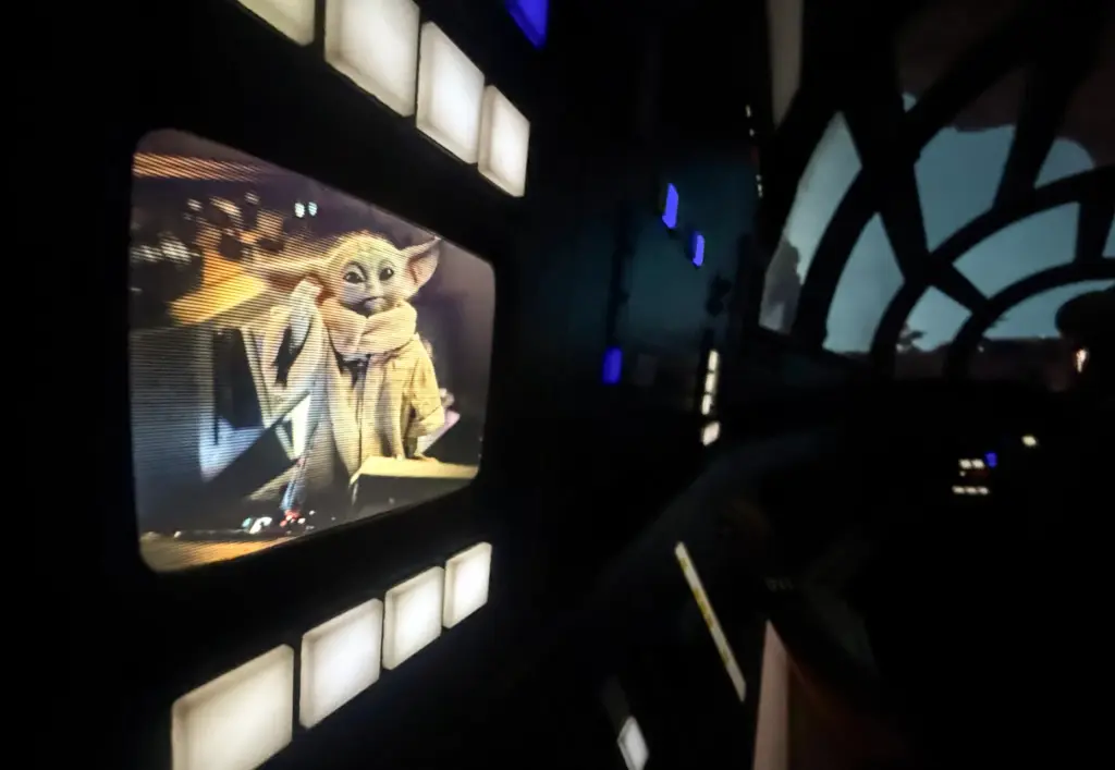 Grogu helps guide riders on screens inside Millennium Falcon: Smugglers...