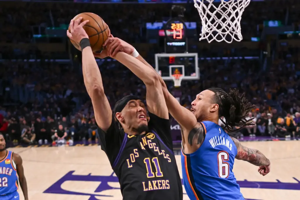 Lakers center Jaxson Hayes, left, is fouled by the Oklahoma...
