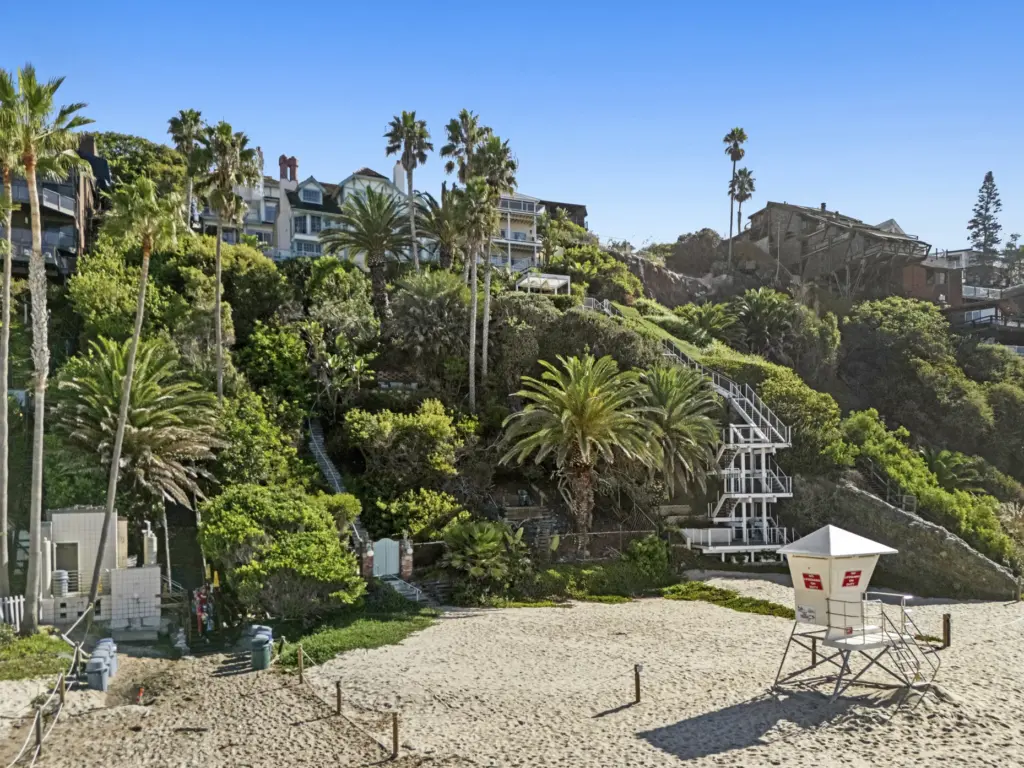 The deeded sand area sits behind a public lifeguard tower....