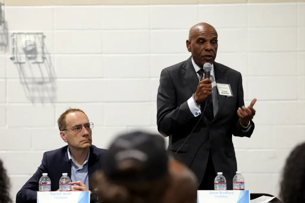 California Insurance Commissioner candidate Steve Bradford, right, speaks alongside fellow...